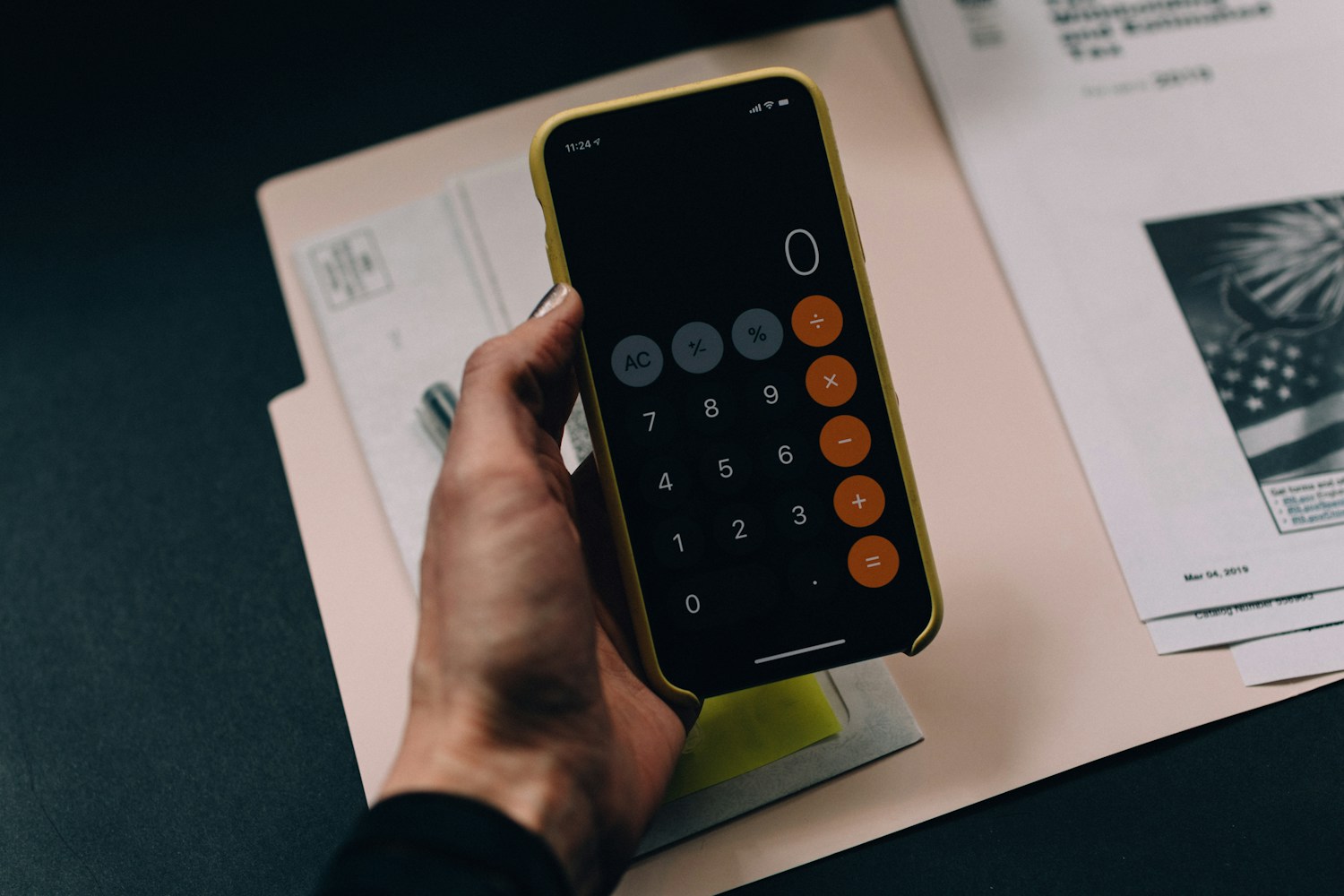 Financial planning documents and a calculator arranged on a desk
